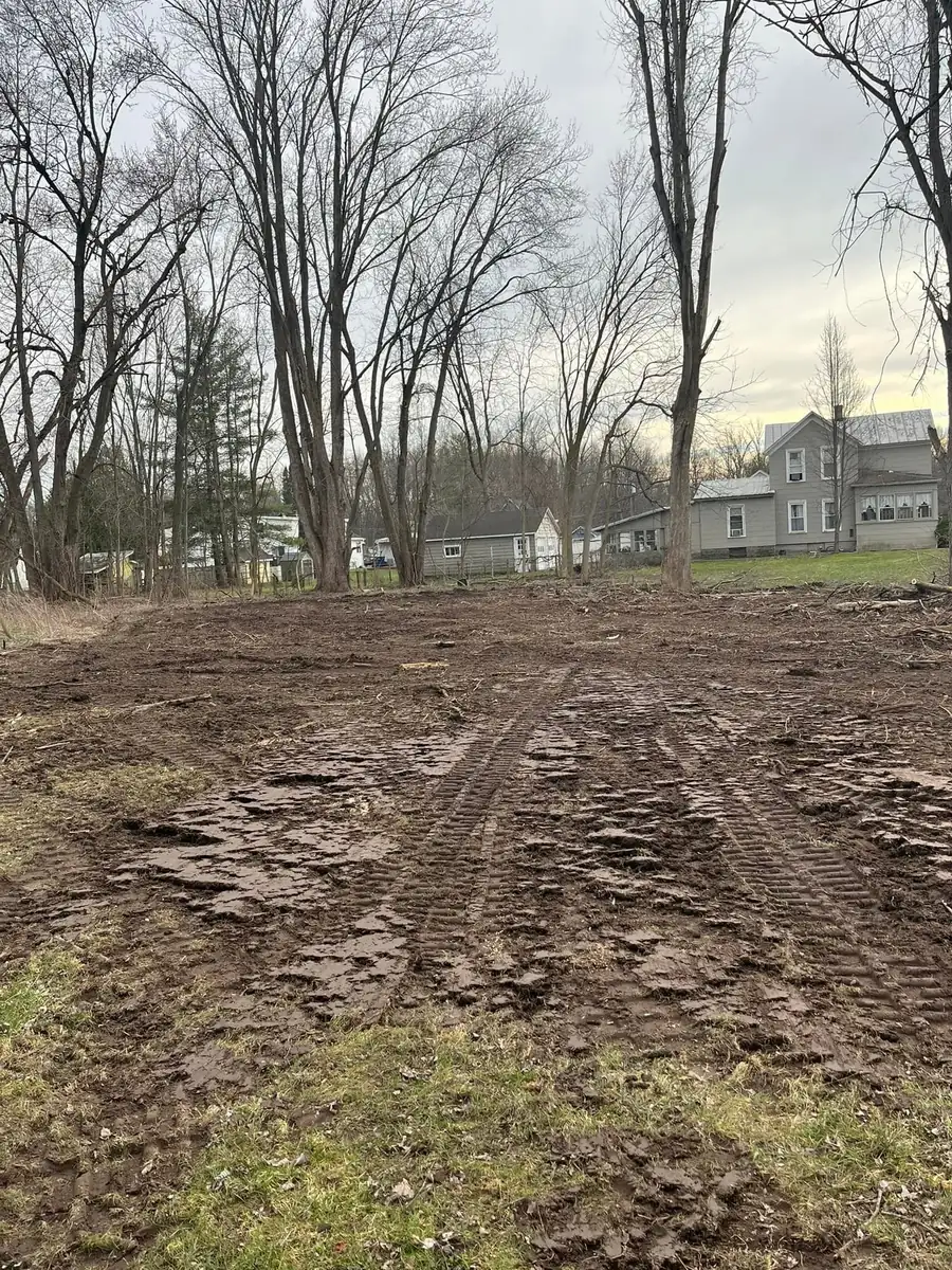 Rough graded building lot with machine tracks