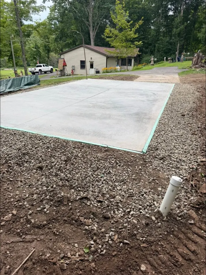 Monolithic slab with a frost free hydrant standpipe beside it in Oxford, NY