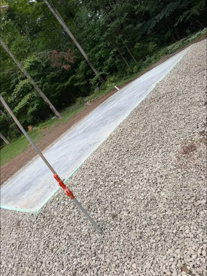 Long monolithic slab on a crushed stone pad in Oxford, NY