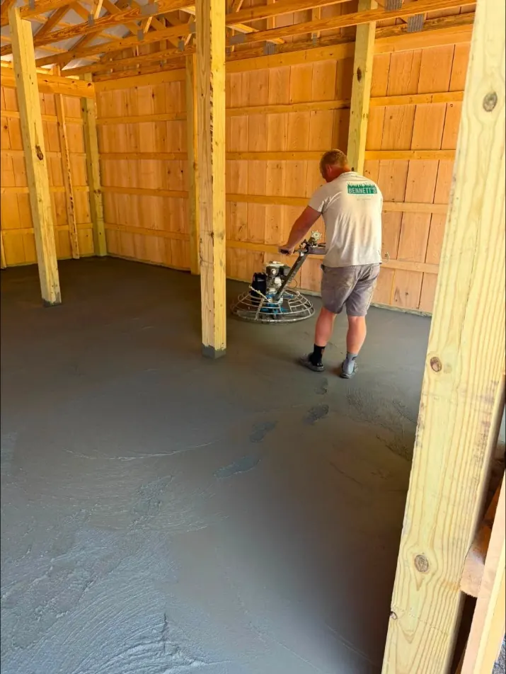 Finishing a pole building floor with a walk-behind power trowel