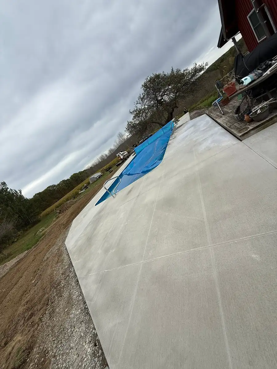 Wide broom finish concrete pool deck