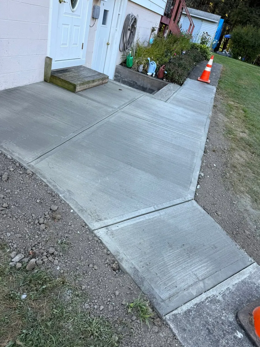 New broom finish sidewalk to a side door