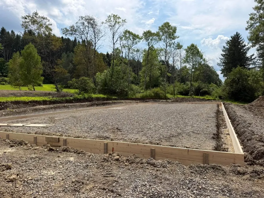 Form & Base: Wood forms set on a crushed stone base, ready for a slab pour