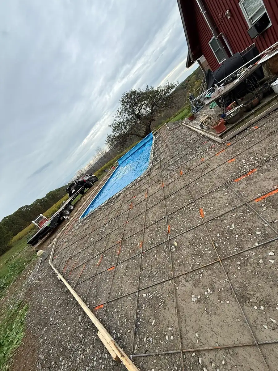 Stamped concrete pool deck being cut and finished