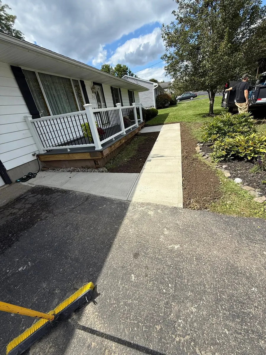 New broom finish walkway running from the porch to the driveway